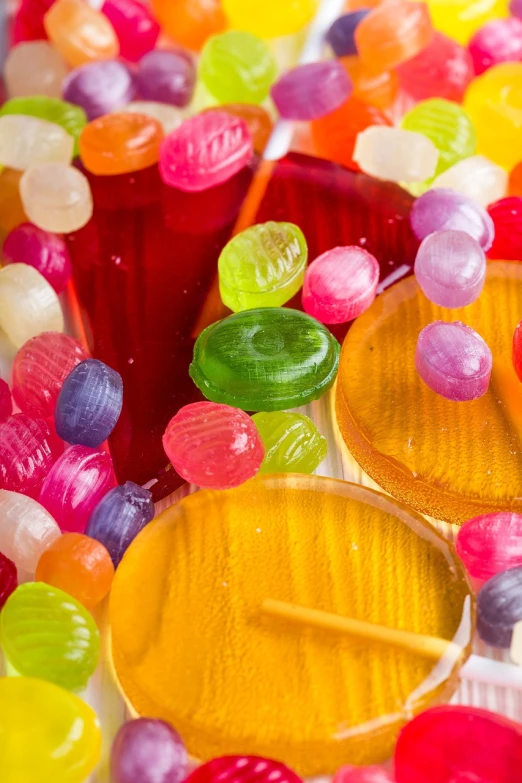 a pile of jelly candy sitting on top of a table, a stock photo, inspired by Bernd Fasching, pexels, process art, full of colour 8-w 1024, soap bubbles, juice, masami suda