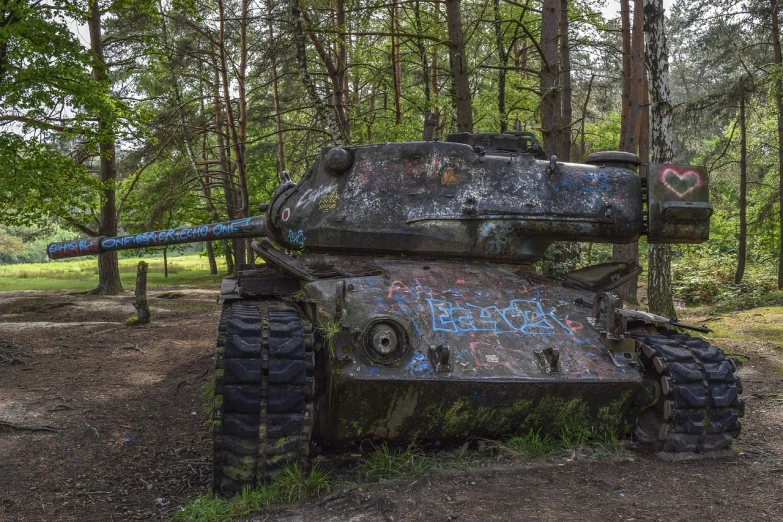 a rusted out tank sitting in the middle of a forest, by Arnie Swekel, flickr, graffiti, eastern front, 2 4 mm iso 8 0 0, panther, slimmer demeanor