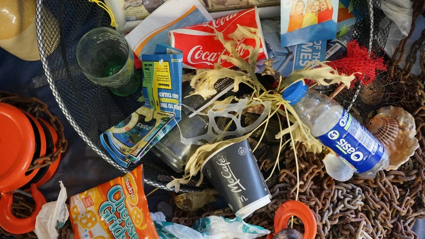 a pile of junk sitting on top of a table, a still life, pexels, assemblage, coke and chips on table, plastic texture, sun coast, shack close up