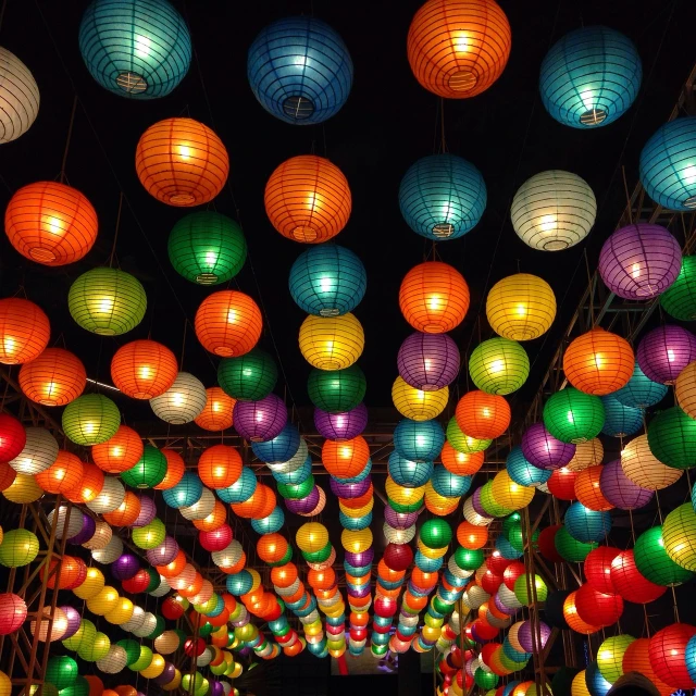 a street filled with lots of colorful paper lanterns, by Matt Stewart, maximalism, symmetric lights, lights on ceiling, night color, retro lights