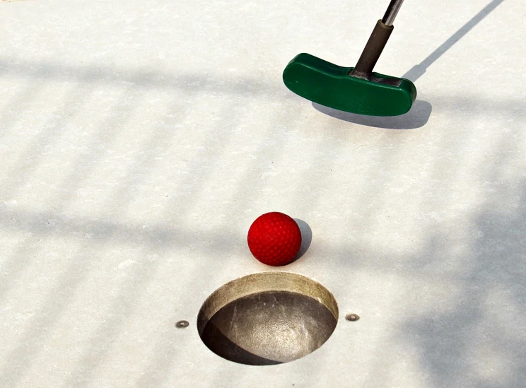 a golf ball and putt putt putt putt putt putt putt putt putt putt putt putt, by Ben Zoeller, flickr, winter sun, sport game, award - winning photo. ”, perfect shading