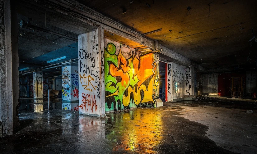 a room with graffiti on the walls and floor, flickr, graffiti, ( ( ( ( ( dan mumford ) ) ) ) ), red - yellow - blue building, lighting on concrete, leaking