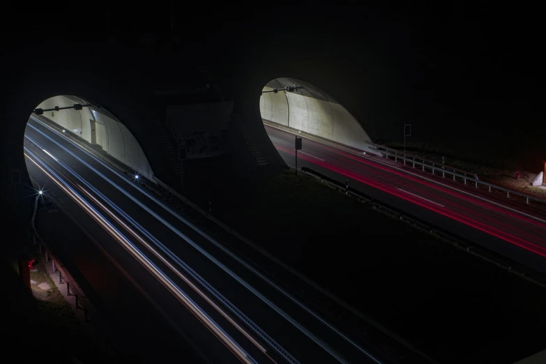 a train traveling through a tunnel at night, by Oskar Lüthy, flickr, bmw, buzzing fluorescent lights, by joseph binder, alessio albi