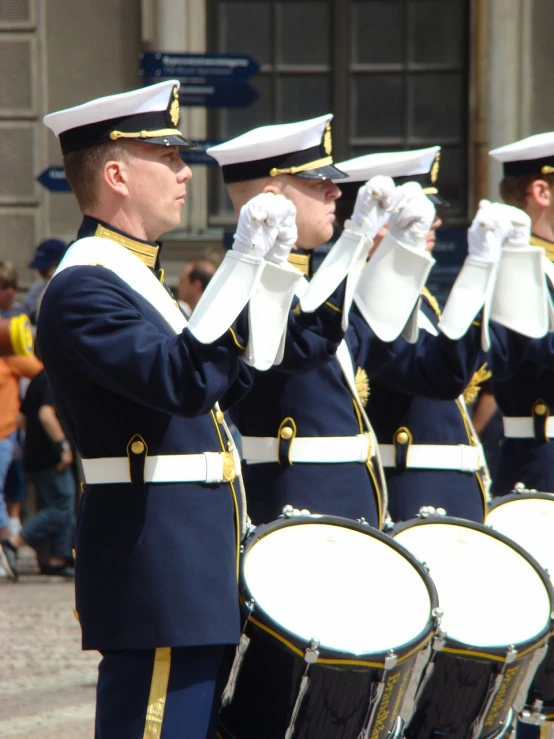 a group of men in uniform standing next to each other, inspired by Carl Gustaf Pilo, flickr, playing drums, amsterdam, trident, closeup!!!!!!