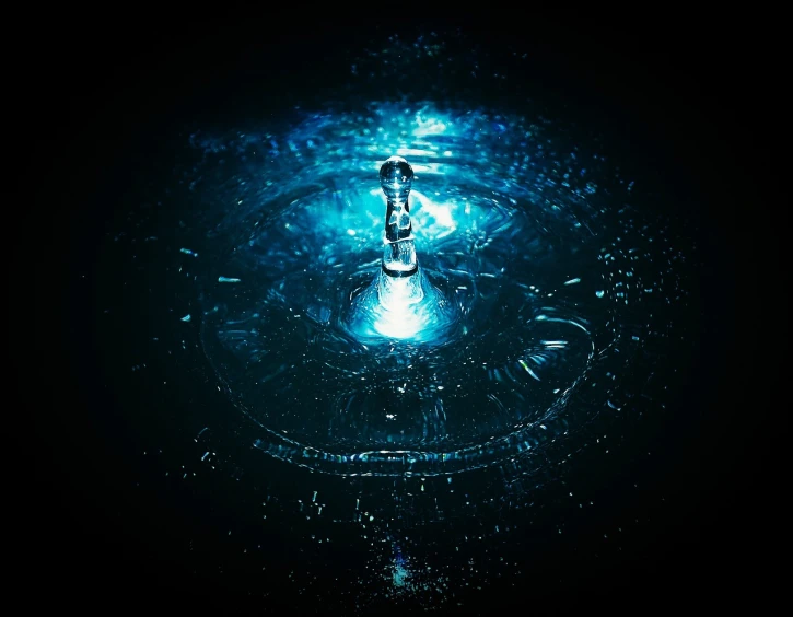 a close up of a water drop in a sink, digital art, blue lighting. fantasy, high quality product image”, intricate sparkling atmosphere, on black background