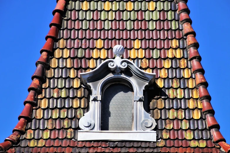 a clock that is on the side of a building, inspired by Tilo Baumgärtel, art nouveau, roofing tiles texture, colorful palette, church window, high detail photo