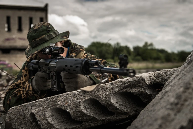 a man in camouflage holding a machine gun, shutterstock, military buildings, shot with canon eoa 6 d mark ii, avatar image, wallpaper - 1 0 2 4