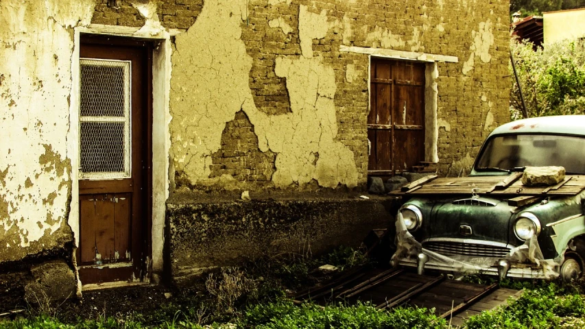 an old car parked in front of a building, by Alexander Bogen, pexels contest winner, renaissance, grimy walls, andrey gordeev, wallpaper - 1 0 2 4, in front of a garage