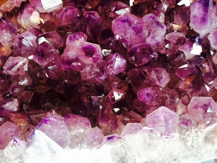 a pile of purple crystals sitting on top of a table, by Anna Haifisch, ultra texture, vine, reddish, citrinitas