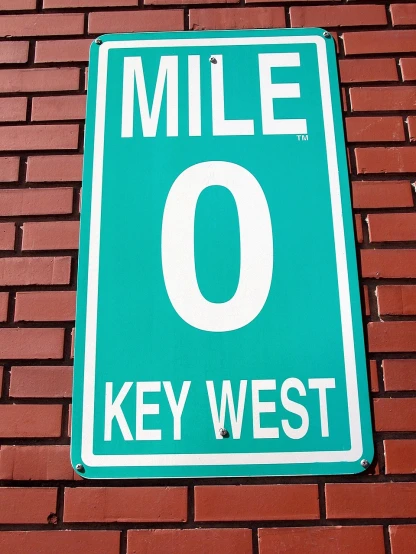 a close up of a street sign on a brick wall, by Matthew D. Wilson, keys, view for miles, 10k, kayne west