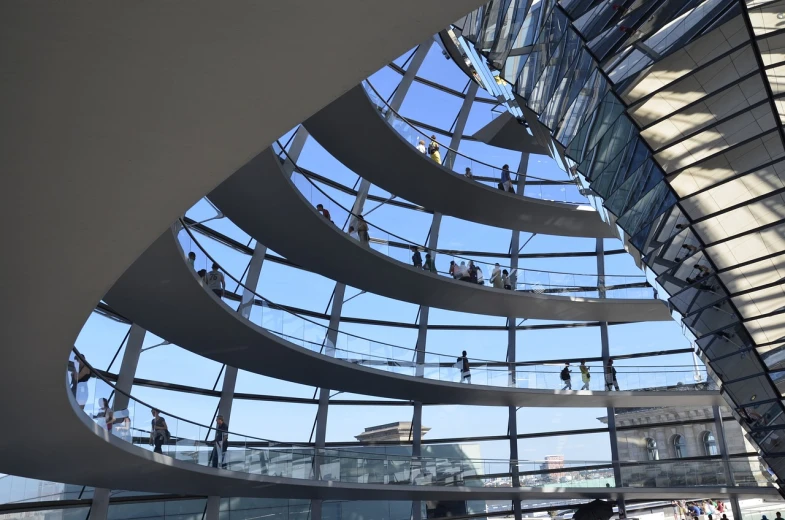 a group of people standing inside of a building, by Oskar Lüthy, flickr, inside a dome, sky bridge, lots of glass details, german