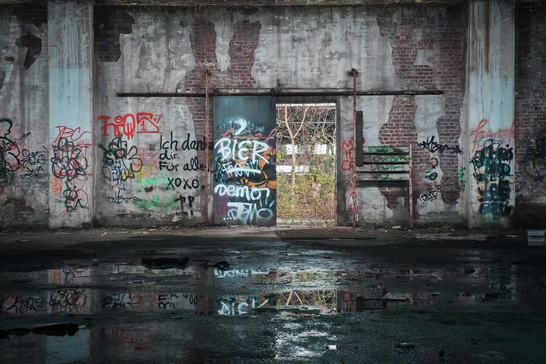 a dirty building with graffiti all over it, a photo, by Carl Rahl, pexels contest winner, water reflections, portal to hell, hannover, [[empty warehouse]] background