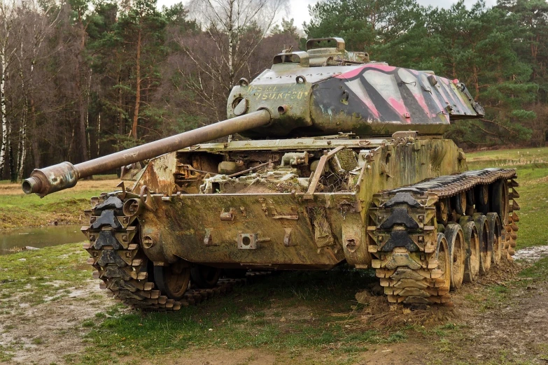 an old tank sitting in the middle of a field, by Arnie Swekel, flickr, auto-destructive art, 4k detail, panther, covered in mud, a wooden