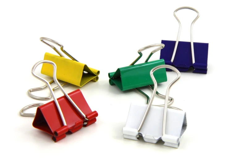 a group of paper clips sitting on top of each other, product photograph, clamp, vibrante colors, traps