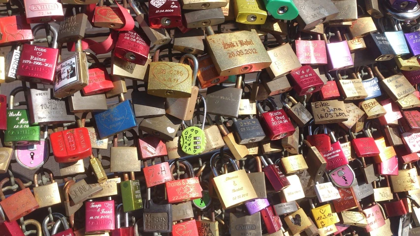 a bunch of padlocks attached to a wall, a photo, assemblage, lots of bridges, elvis, 2 0 5 6, hugs