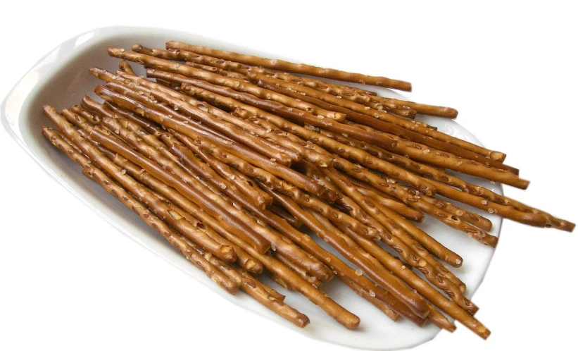 a close up of a plate of pretzels, reddit, rasquache, single long stick, twigs, high detail product photo, brittle. highly detailed