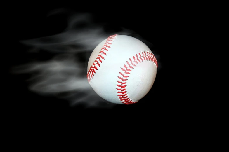 a baseball flying through the air on a black background, a picture, by Andrew Domachowski, shutterstock, conceptual art, fog mist smoke, tourist photo, round, heat