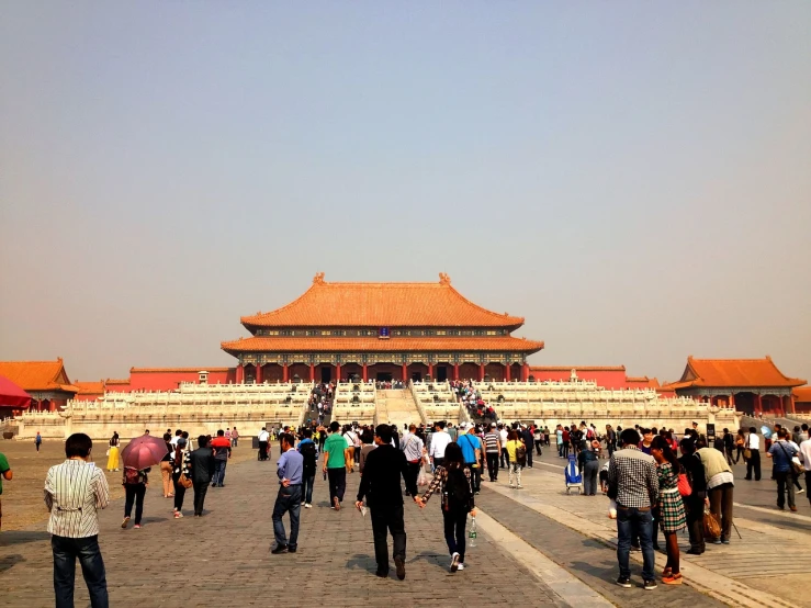 a group of people standing in front of a building, a picture, by Weiwei, ancient chinese architecture, many people walking about, giant hall, calm weather