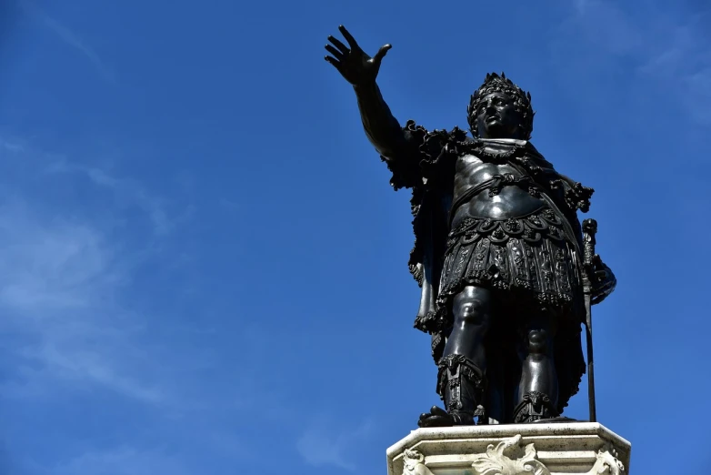 a statue of a man with a sword in front of a blue sky, by Pogus Caesar, shutterstock, morbidly obese, he is wearing a black, celebrating a king being crowned, italy