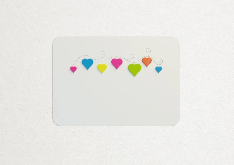 a close up of a piece of paper with hearts on it, by Shigeru Aoki, card back template, full color, rounded corners, miniature product photo