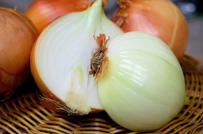 a close up of some onions in a basket, a picture, by Harold von Schmidt, pixabay, renaissance, pale green glow, white horns, a pair of ribbed, shiny crisp finish