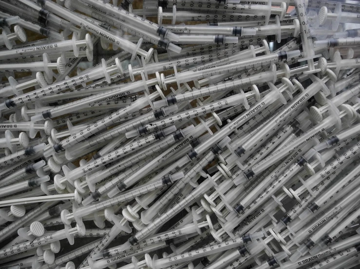 a pile of sylls sitting on top of each other, plasticien, syringes, high details photo, reuters, medical machinery