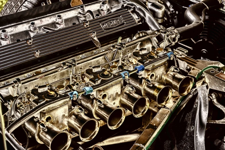 a close up of the engine of a car, by Thomas Häfner, photorealism, ae 8 6, tonemapped, vintage aston martin, shiny brass