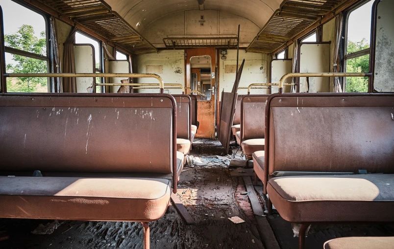 a view of the inside of a train car, a portrait, shutterstock, abandoned cars, bronze!! (eos 5ds r, old chairs, abandoned bus stop