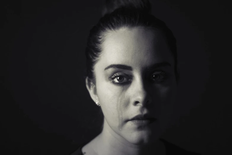 a black and white photo of a woman's face, a black and white photo, heartbroken, young woman in her 20s, tears running down face, avatar image