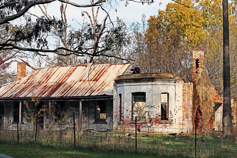 an old house with a rusted tin roof, a portrait, by Brenda Chamberlain, featured on pixabay, fine art, in australia, ruined subdivision houses, photograph taken in 2 0 2 0, old shops