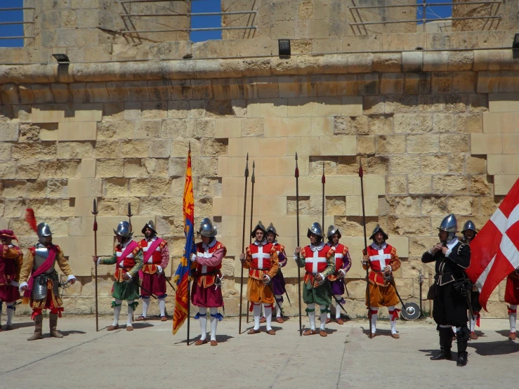 a group of men standing next to each other holding flags, by Robert Brackman, flickr, renaissance, conversano, guards intricate, july 2 0 1 1, colorful hilt