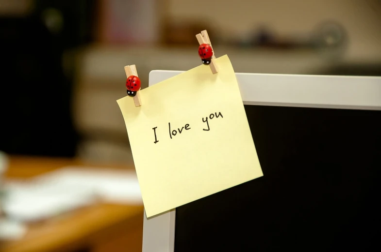 a note pinned to a computer monitor that says i love you, flickr, cute!, yellow, istock, desk