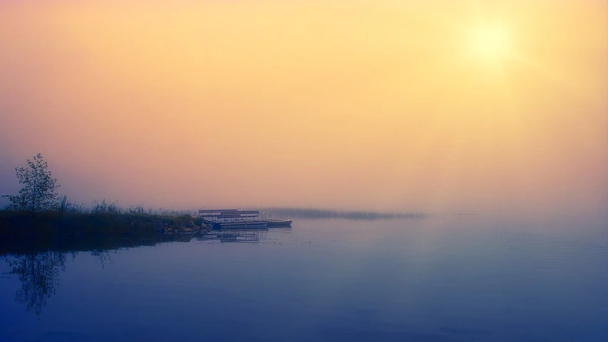 a boat sitting on top of a body of water, a picture, by Yi Jaegwan, minimalism, light orange mist, enhanced photo, boat dock, the sun is shining. photographic