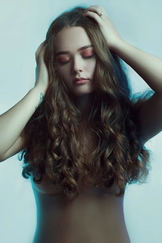 a close up of a person with long hair, inspired by Elsa Bleda, shutterstock, renaissance, “ sensual, with curls, studio medium format photograph, maxim sukharev