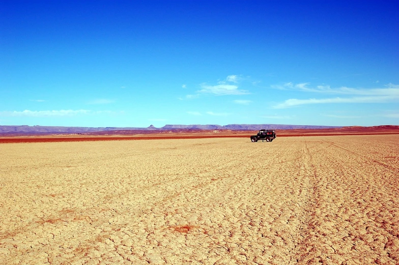 a truck that is sitting in the dirt, inspired by Scarlett Hooft Graafland, flickr, wide open space, wide shot!!!!!!, in chuquicamata, beautiful day