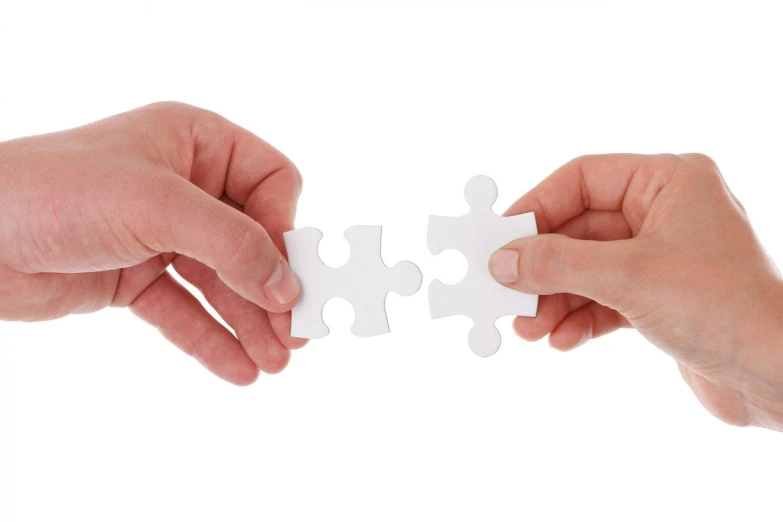 two hands holding two pieces of white puzzle, a jigsaw puzzle, by Joseph Werner, shutterstock, on white background, connections, 2 people, set pieces