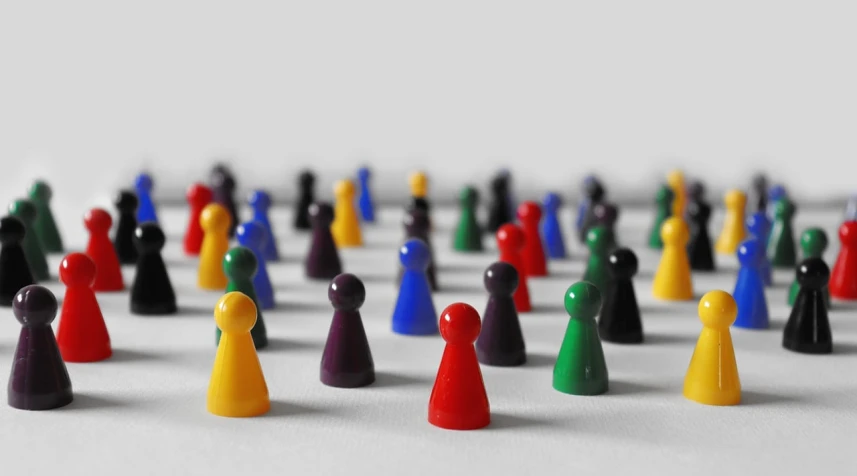 a group of colorful pawns sitting on top of a white surface, a tilt shift photo, synthetism, crowded people, high res photo, pins, robed figures sat around a table