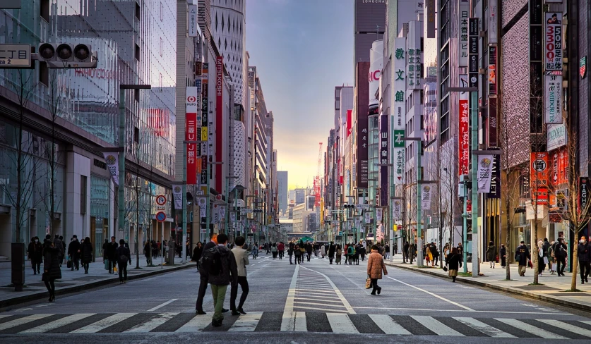 a group of people walking down a street next to tall buildings, a photo, by Tadashige Ono, shutterstock, ukiyo-e, beautiful late afternoon, empty streetscapes, stock photo, bladerunner street