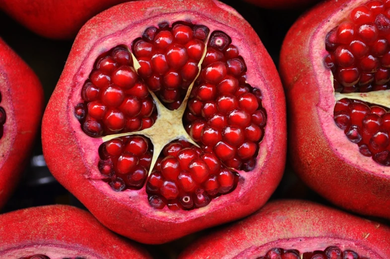 a close up of a pomegranate cut in half, pexels, 1024x1024, maroon red, group photo, red lanterns