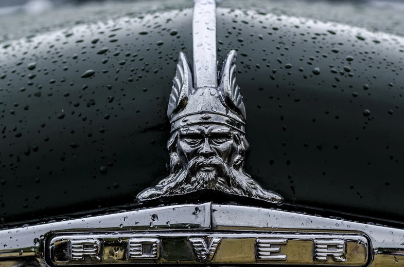 a close up of a hood ornament on a car, a portrait, by Roar Kjernstad, renaissance, valkyrie, photo taken with provia, iceland, by greg rutkowski