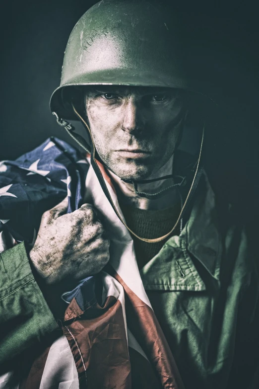 a man in a military uniform holding an american flag, a colorized photo, by Adam Marczyński, shutterstock, hearts of iron portrait style, attack zombie during worldwar 2, low key, rogue trooper