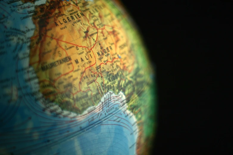 a close up of a globe with a black background, a tilt shift photo, by Matija Jama, digital art, morocco, c 4 d ”