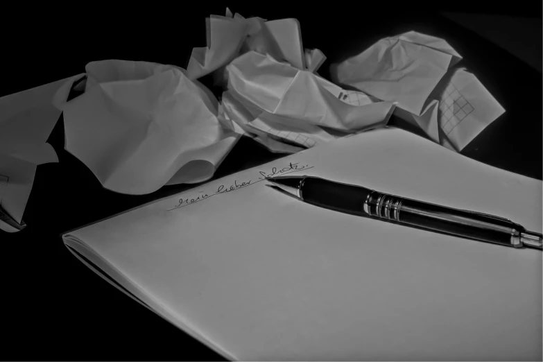 a pen sitting on top of a piece of paper, by Aleksander Gierymski, realism, 15081959 21121991 01012000 4k, dreams, writing a letter, dark and white