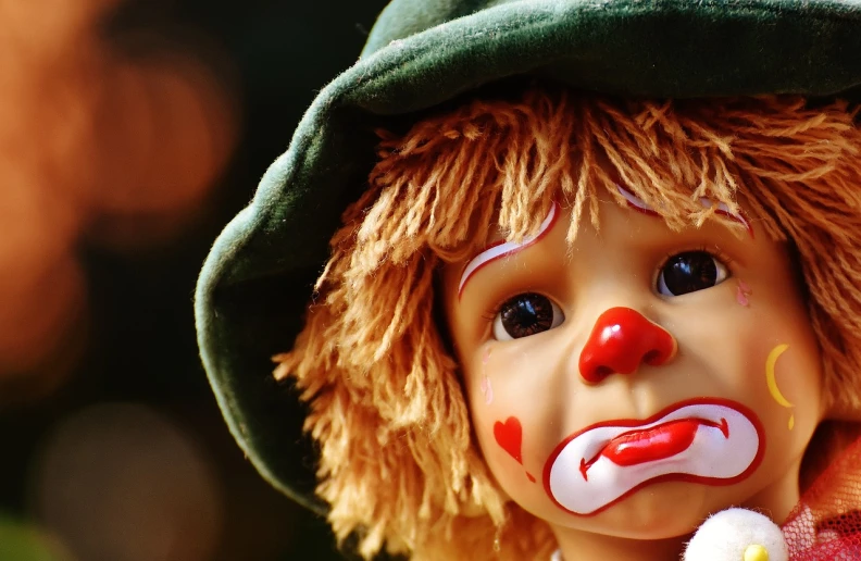 a close up of a clown doll wearing a green hat, trending on pixabay, lowbrow, scar on face, beautiful wallpaper, little kid, wallpaper - 1 0 2 4
