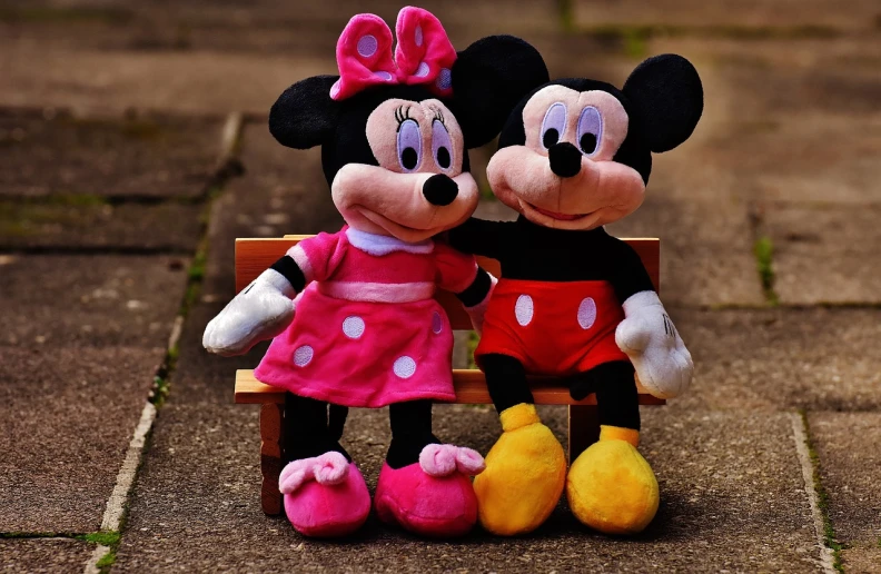 a couple of stuffed animals sitting on top of a wooden bench, a picture, pexels, minnie mouse, disney cartoon face, photo pinterest, matthew stewart