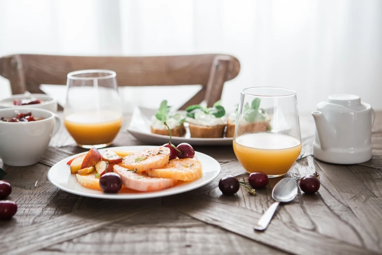 a close up of a plate of food on a table, by Romain brook, pexels, table set for second breakfast, (a bowl of fruit)!!!!!!!!!, peaceful mood, full - body