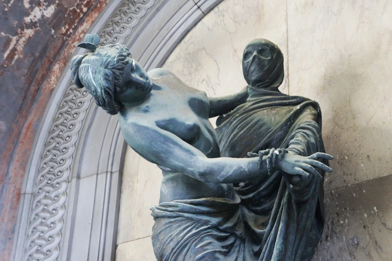 a statue of a man holding a woman, flickr, death of the money lenders, seen from the side, threatening, nymph