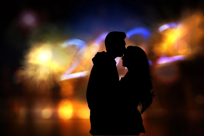 a silhouette of a couple kissing in front of fireworks, a picture, romanticism, bokeh photo