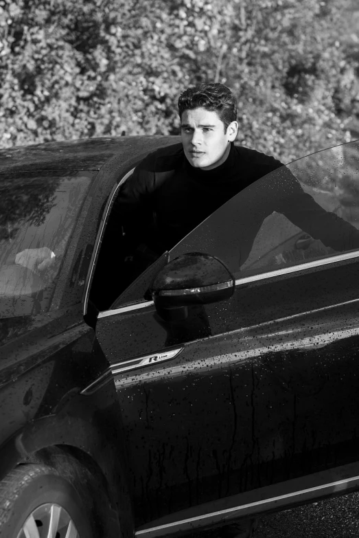 a man leaning out the window of a car, a portrait, by Daniel Gelon, fine art, official dior editorial, f 1 driver charles leclerc, black turtleneck, model pose
