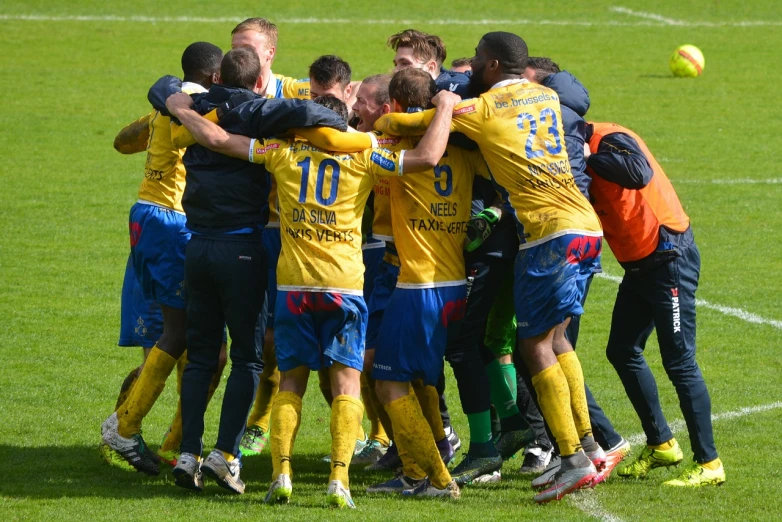 a group of men standing on top of a soccer field, a photo, by January Suchodolski, flickr, hugs, swedish, a bright, winning